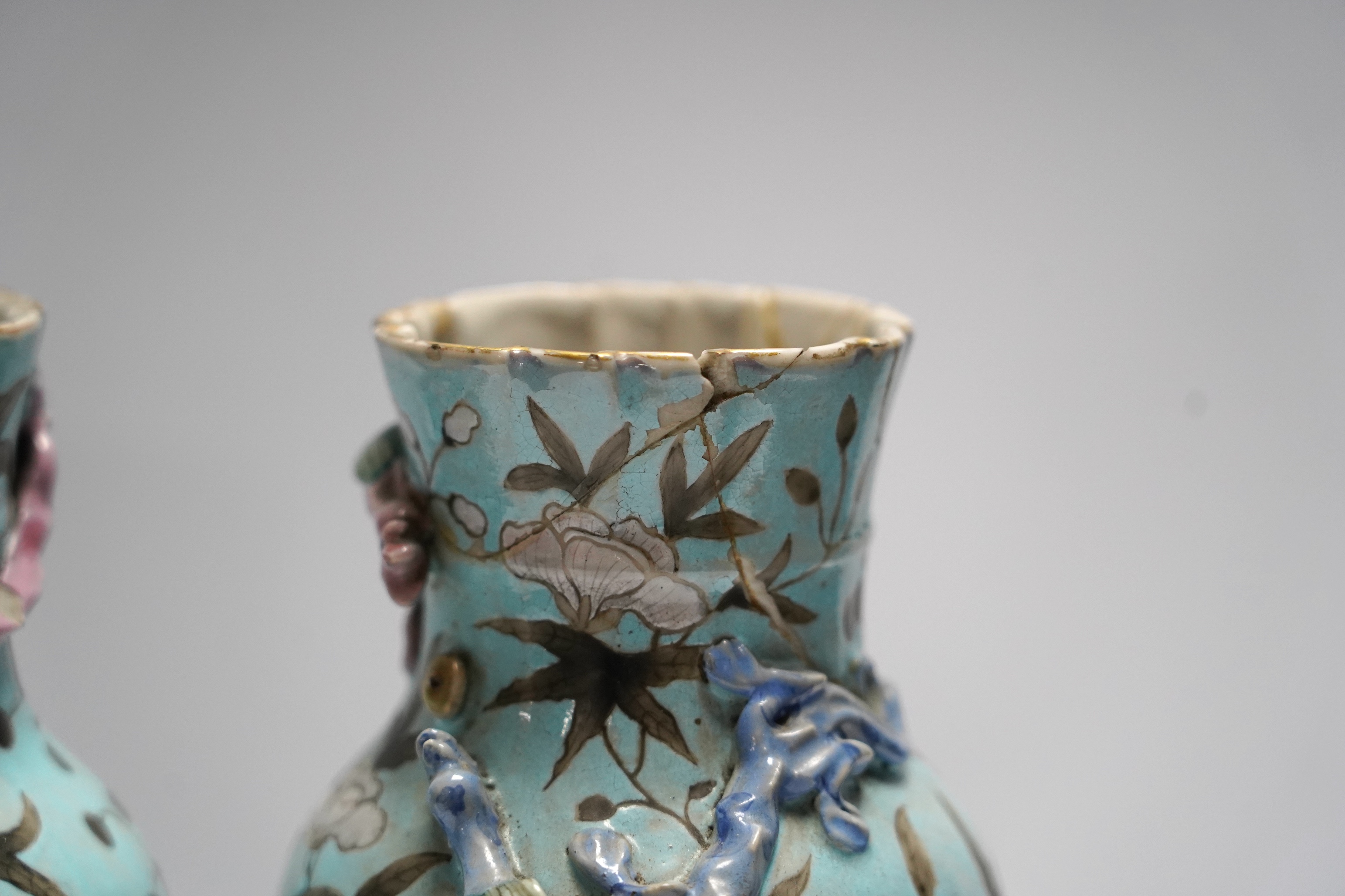 A pair of late 19th century Chinese blue glazed ‘dragon’ vases, 26cm high